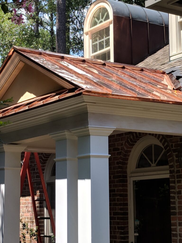 Brady residence with new porch roof replacement by Gary Kent Roofing